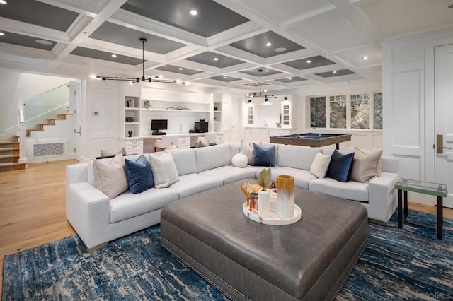 living room featuring beamed ceiling, coffered ceiling, and pool table