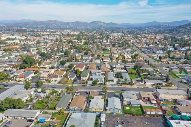 birds eye view of property featuring a mountain view