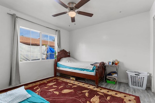 bedroom featuring ceiling fan and hardwood / wood-style flooring