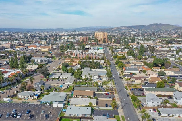 birds eye view of property with a mountain view