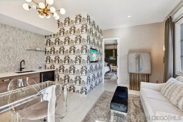 bathroom featuring a chandelier, vanity, and tile patterned flooring