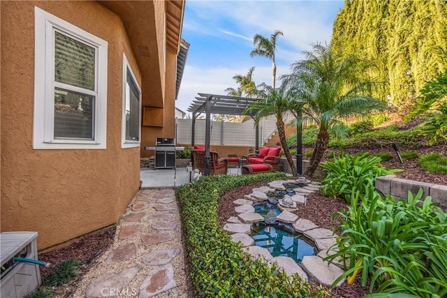 view of yard featuring a pergola, outdoor lounge area, and a patio