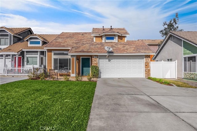 view of front of house with a front yard and a garage