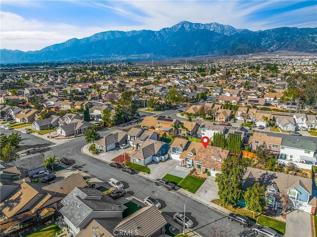 birds eye view of property with a mountain view