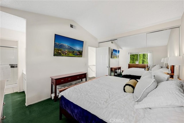 carpeted bedroom featuring lofted ceiling