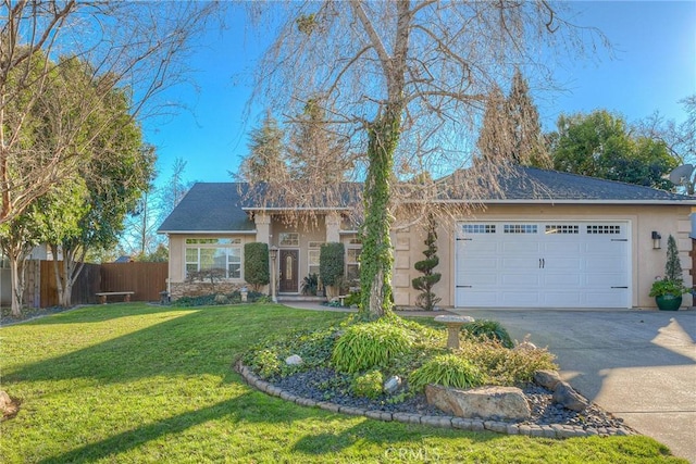 view of front of home featuring a garage and a front yard