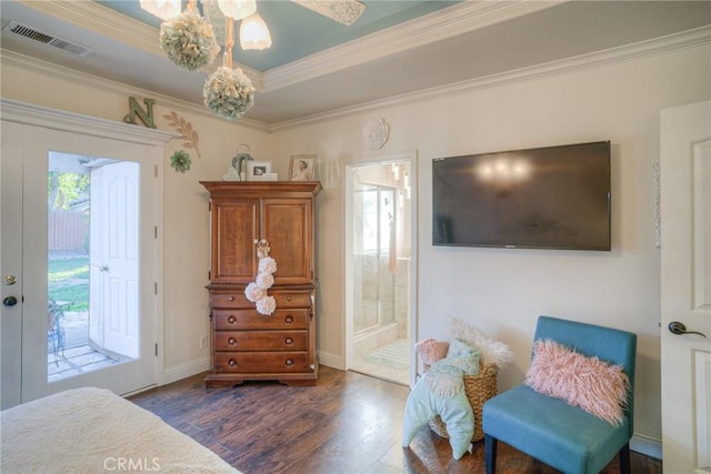 interior space with dark wood-type flooring, ensuite bathroom, ceiling fan, access to exterior, and ornamental molding