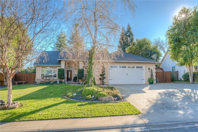 ranch-style home featuring a garage and a front yard