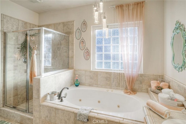 bathroom with separate shower and tub