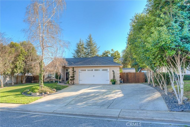 ranch-style home with a garage and a front lawn