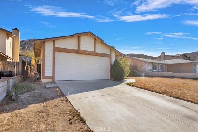 ranch-style home featuring a garage