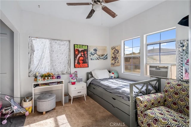 bedroom with ceiling fan, cooling unit, and carpet floors