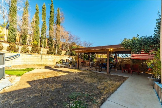 surrounding community featuring a patio