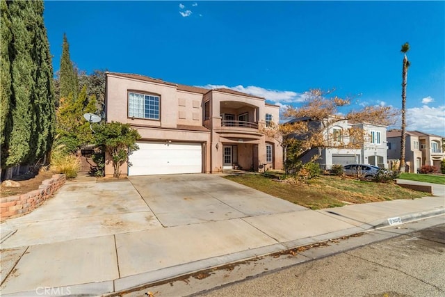 view of front property with a balcony and a garage