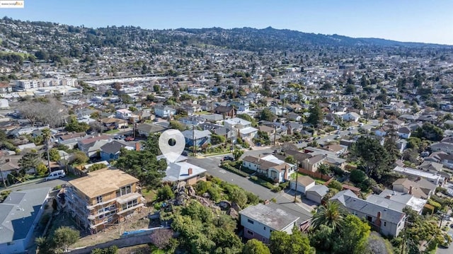 birds eye view of property featuring a mountain view