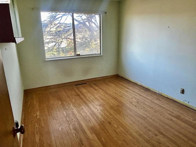 empty room with light wood-type flooring