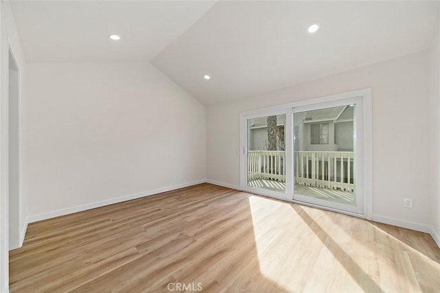 bonus room featuring light hardwood / wood-style flooring and vaulted ceiling