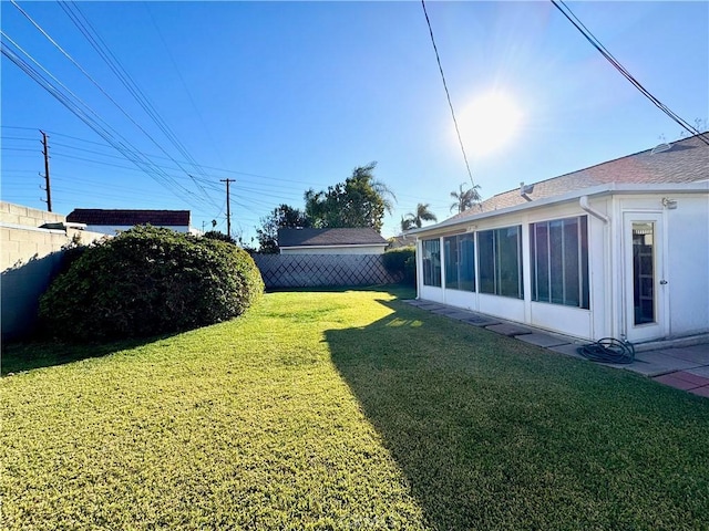 view of yard featuring a sunroom