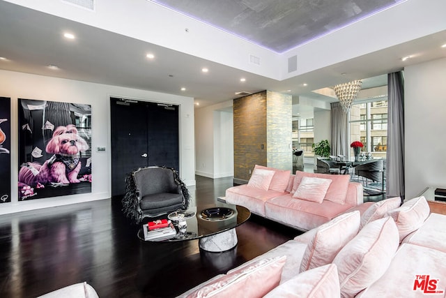 living room with an inviting chandelier