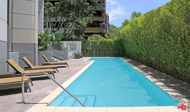 view of swimming pool featuring a patio