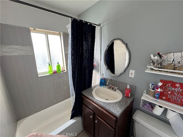 full bathroom featuring vanity, shower / bath combo, and toilet