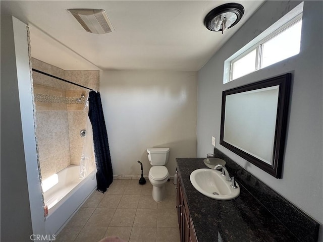 full bathroom with tile patterned flooring, vanity, shower / bath combo, and toilet