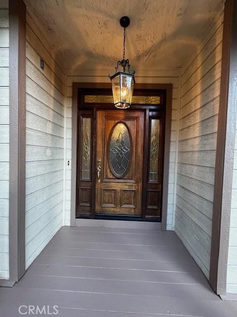 doorway to property with a porch