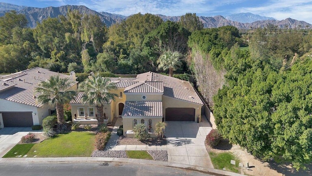 birds eye view of property with a mountain view