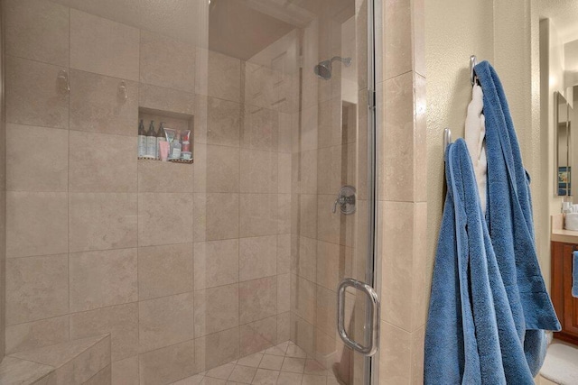 bathroom with a shower with shower door