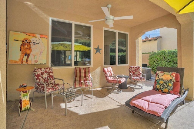 view of patio featuring ceiling fan