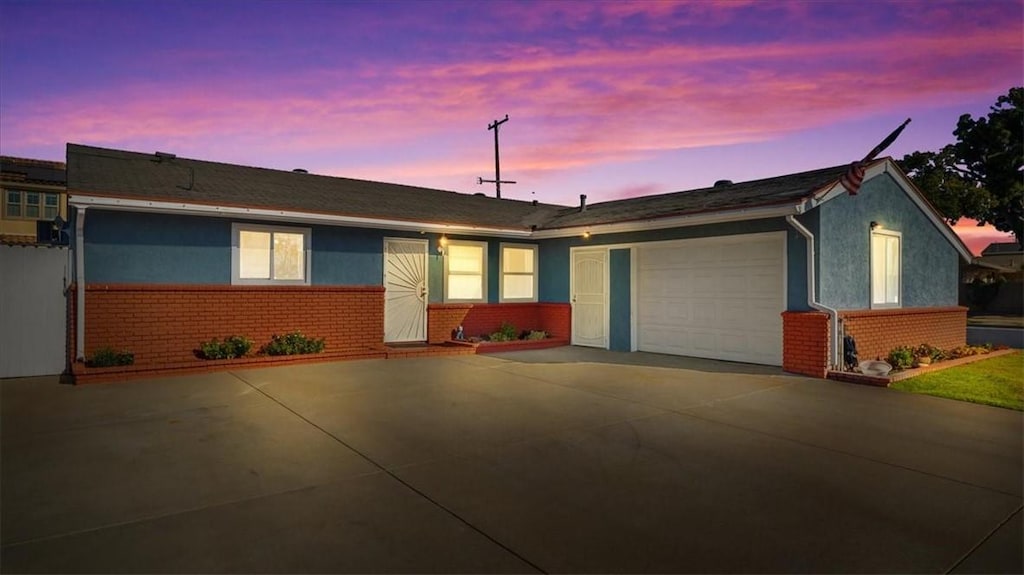 single story home with a garage