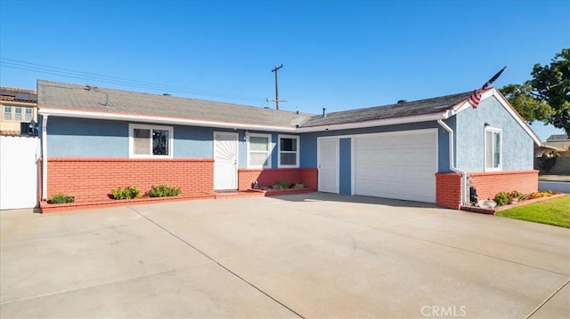 ranch-style home featuring a garage