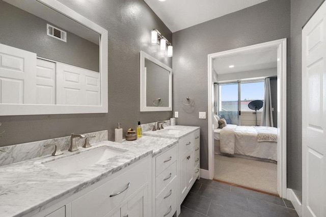 bathroom featuring tile patterned floors and vanity