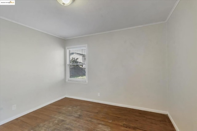 unfurnished room featuring crown molding and dark hardwood / wood-style floors