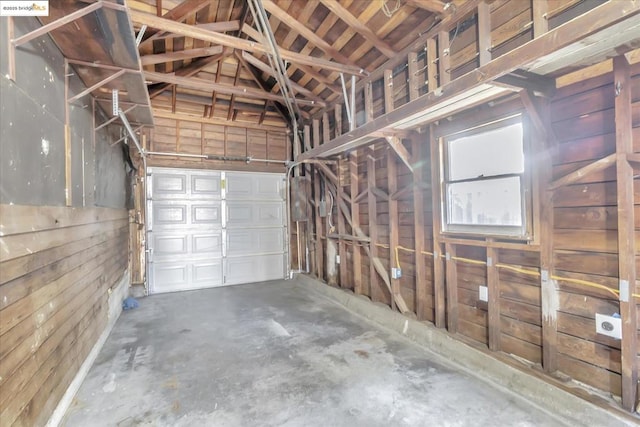 garage featuring wooden walls