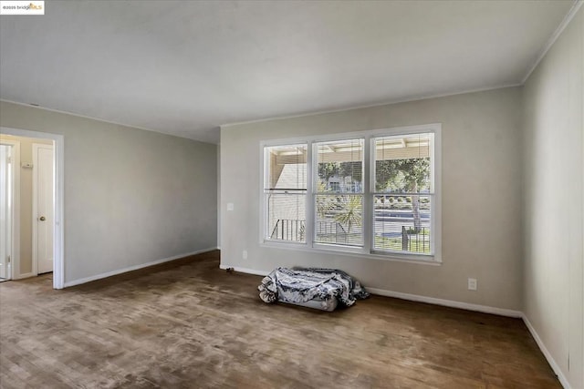 unfurnished room with ornamental molding