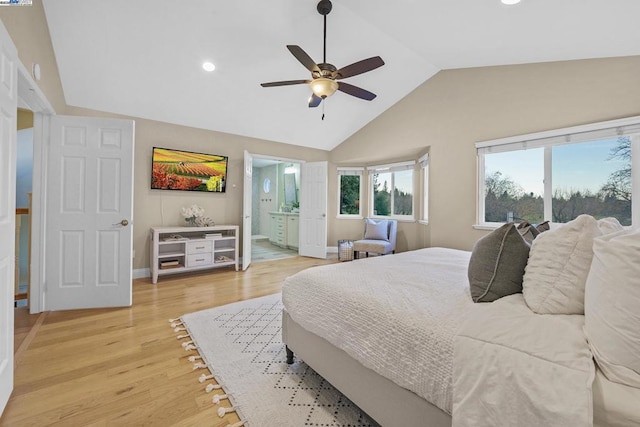 bedroom featuring ensuite bath, ceiling fan, lofted ceiling, and hardwood / wood-style flooring