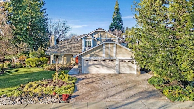 view of front of home featuring a front lawn and a garage