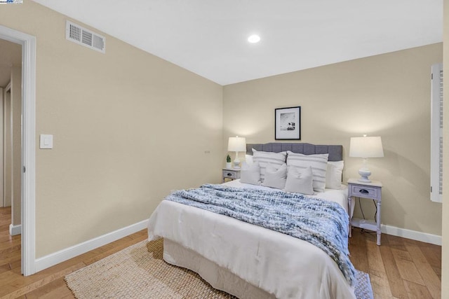 bedroom with light hardwood / wood-style flooring