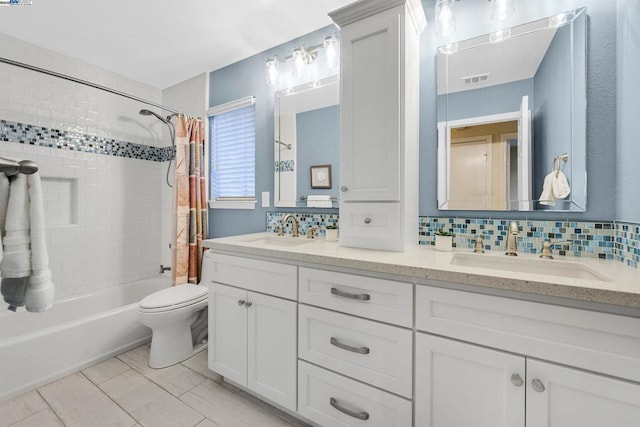 full bathroom with backsplash, shower / tub combo with curtain, vanity, and toilet