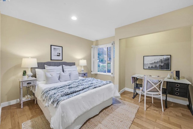 bedroom with light hardwood / wood-style floors