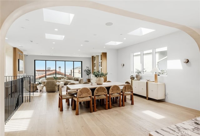 dining room with light wood-style floors and recessed lighting