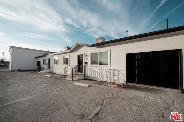 ranch-style home with a garage