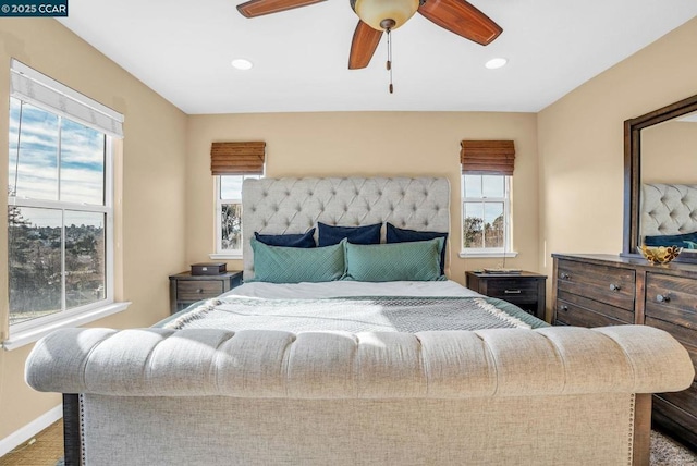 bedroom featuring multiple windows and ceiling fan