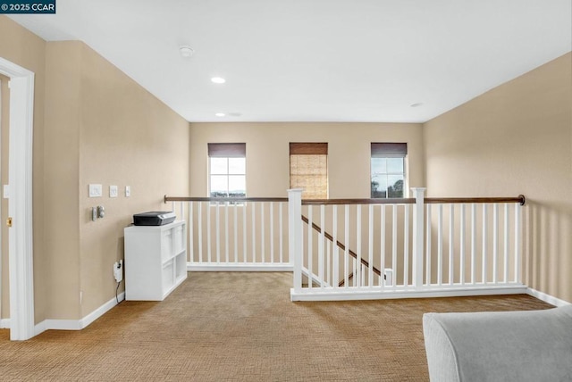 hallway with light carpet