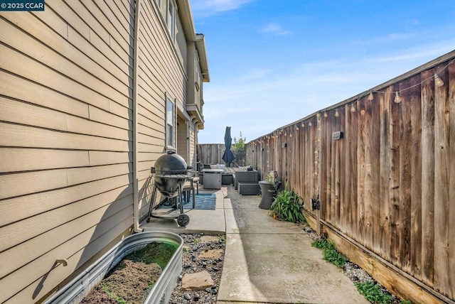 view of home's exterior with a patio and an outdoor hangout area