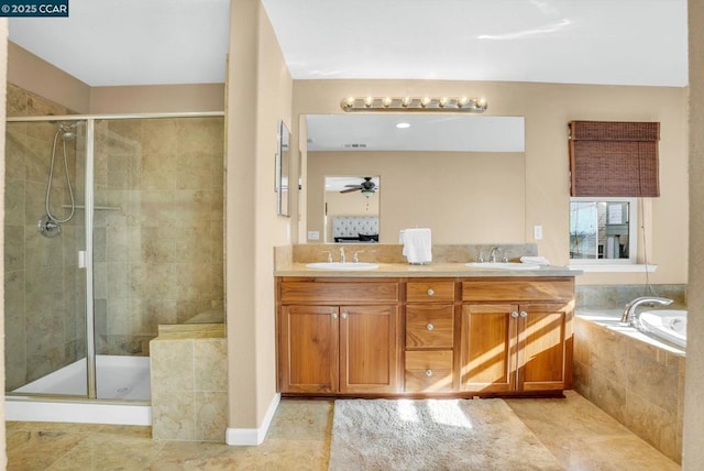 bathroom featuring tile patterned floors, ceiling fan, separate shower and tub, and vanity