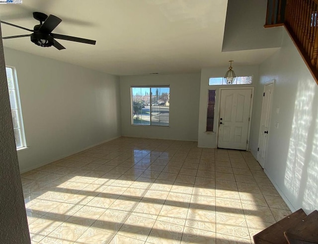 tiled entrance foyer with ceiling fan