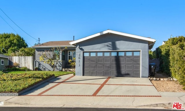 ranch-style house featuring a garage