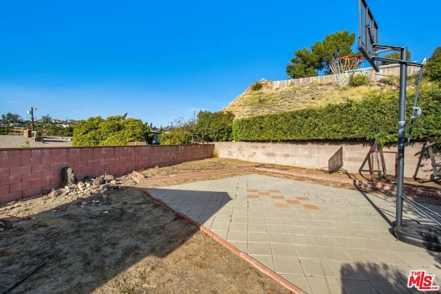 view of patio featuring basketball court